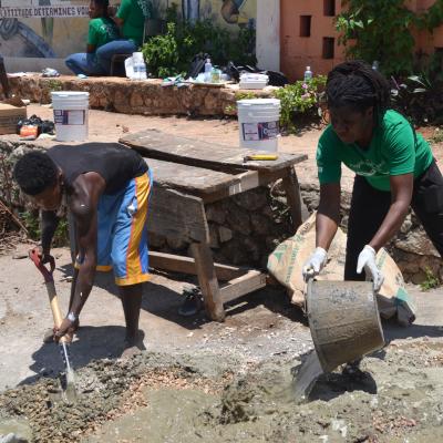 A volunteer helping to build a school at her Building Project placement A Projects Abroad volunteer helping to build a school at her Spring Break Building Project